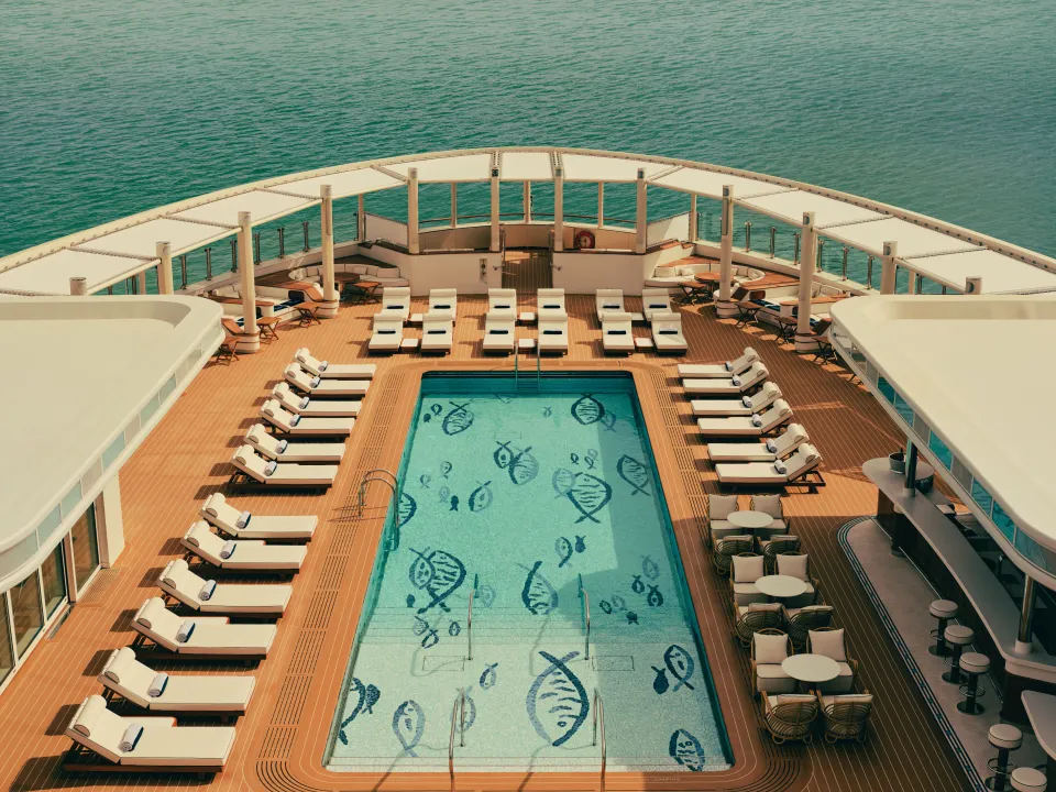 The pool deck of a luxury hotel yacht seen from above